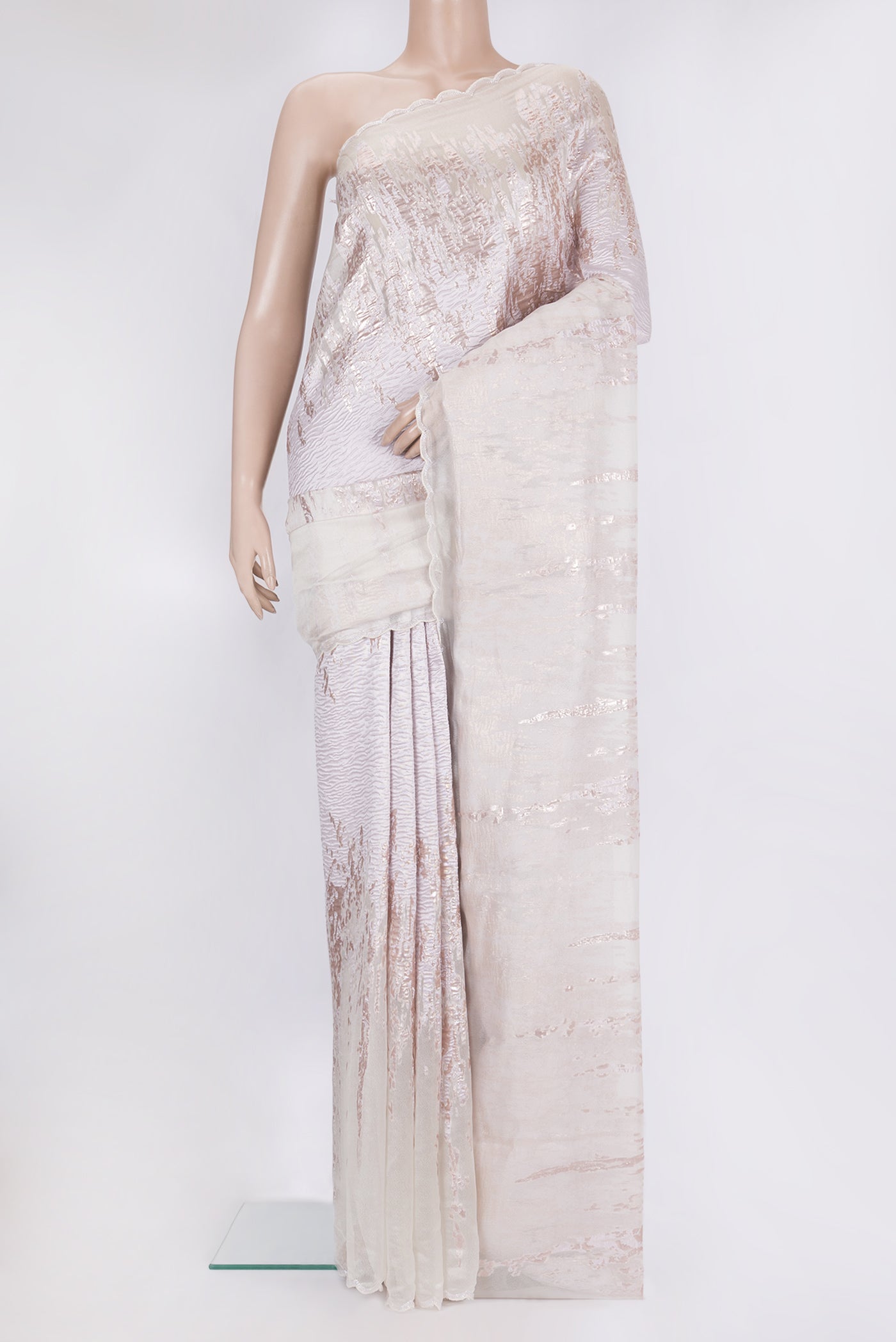 Off White Organza Silk Saree with Zari Brocade on the body and Sequin Border.  displayed on a mannequin