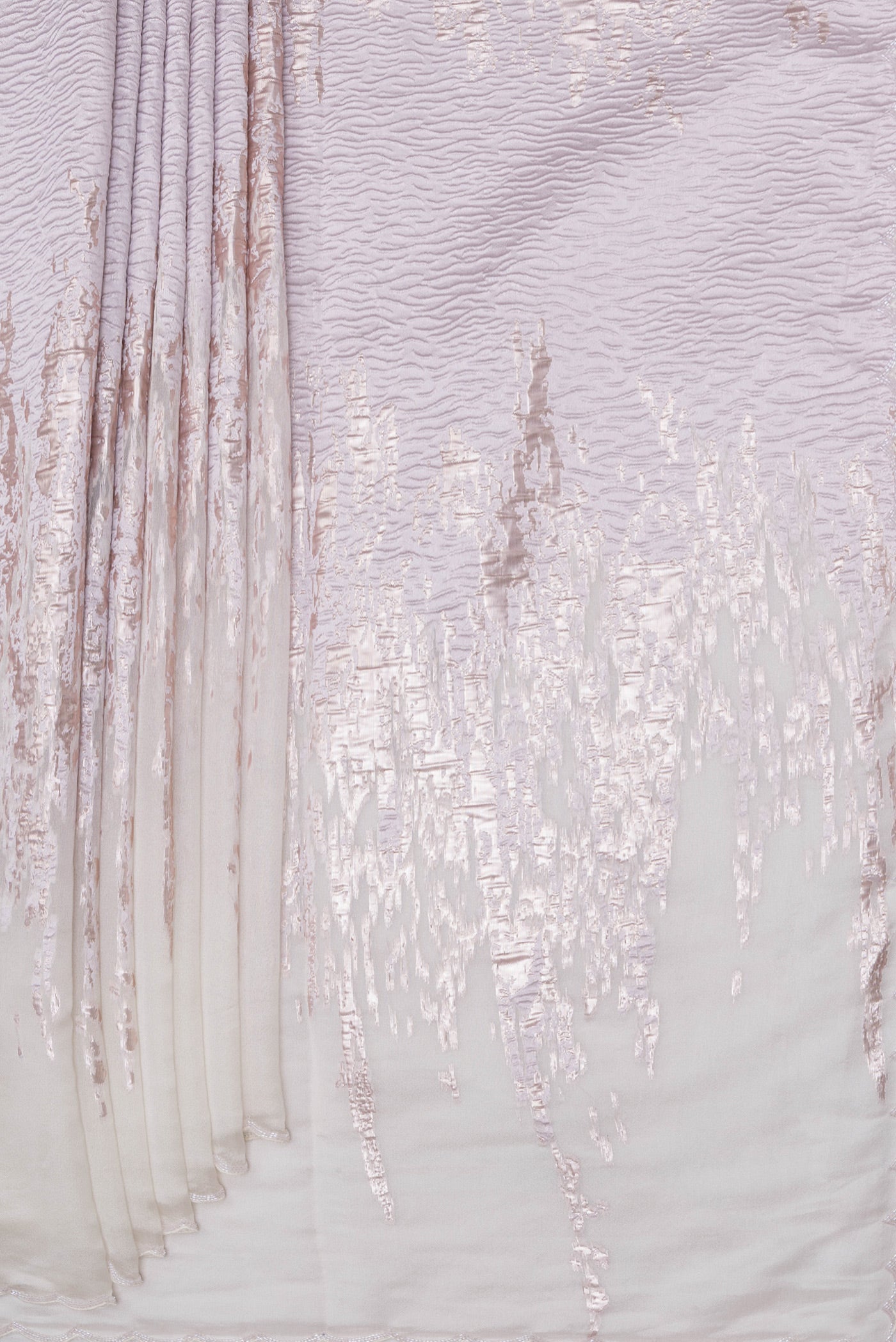 Pleats and pallu of Off White Organza Silk Saree with Zari Brocade on the body and Sequin Border. 