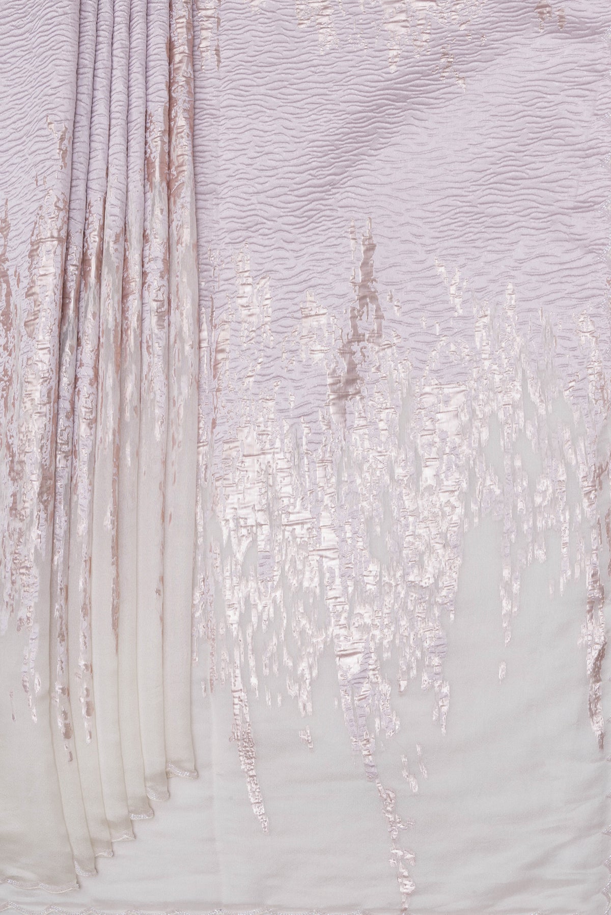 Pleats and pallu of Off White Organza Silk Saree with Zari Brocade on the body and Sequin Border. 