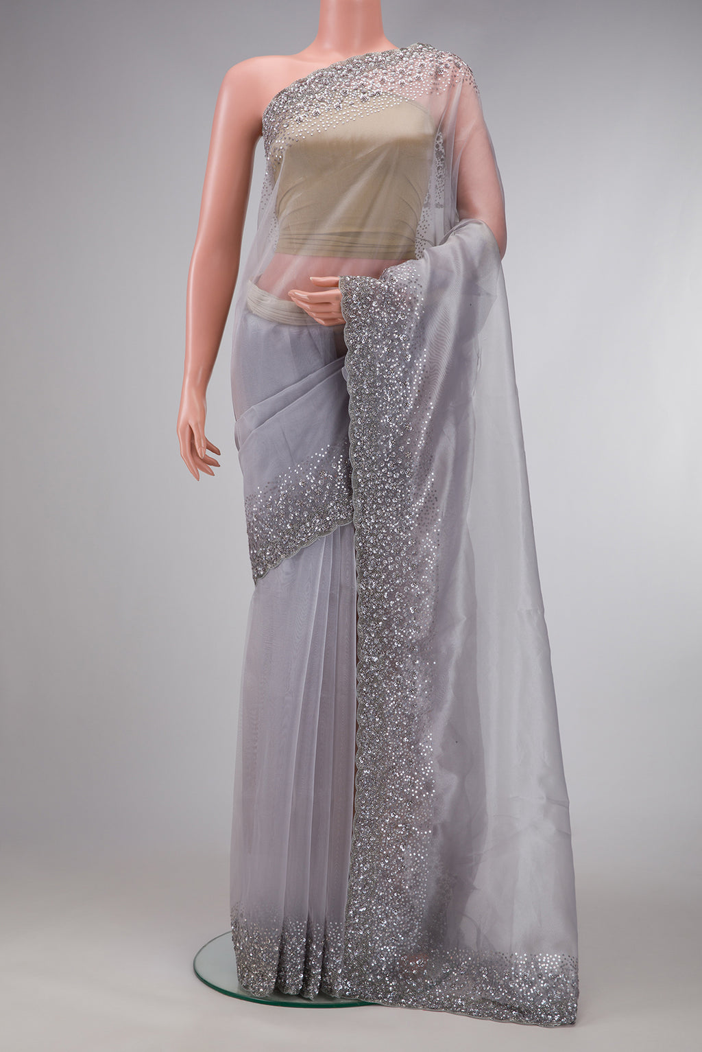 Grey Dual Tone Organza Silk Saree with Plain Body and Embroidery Border.  displayed on a mannequin