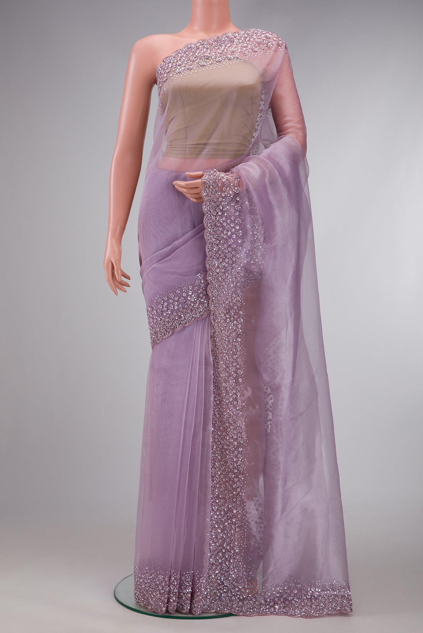 Lavender Dual Tone Organza Silk Saree with Plain Body and Embroidery Border.  displayed on a mannequin