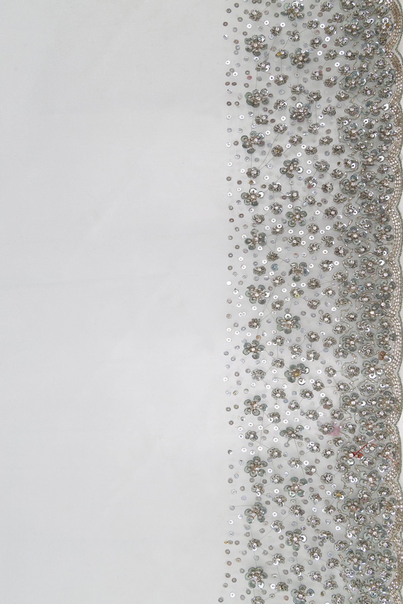 Border image of Grey Dual Tone Organza Silk Saree with Plain Body and Embroidery Border. 