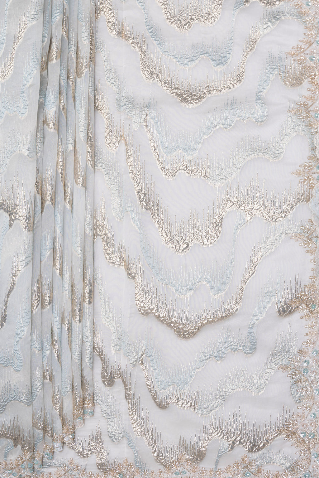 Pleats and pallu of Light Blue Organza Silk Saree with Zari Brocade on the body and Sequin Border. 