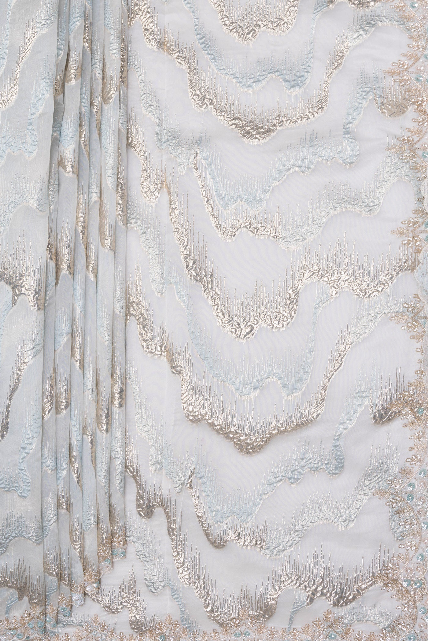 Pleats and pallu of Light Blue Organza Silk Saree with Zari Brocade on the body and Sequin Border. 