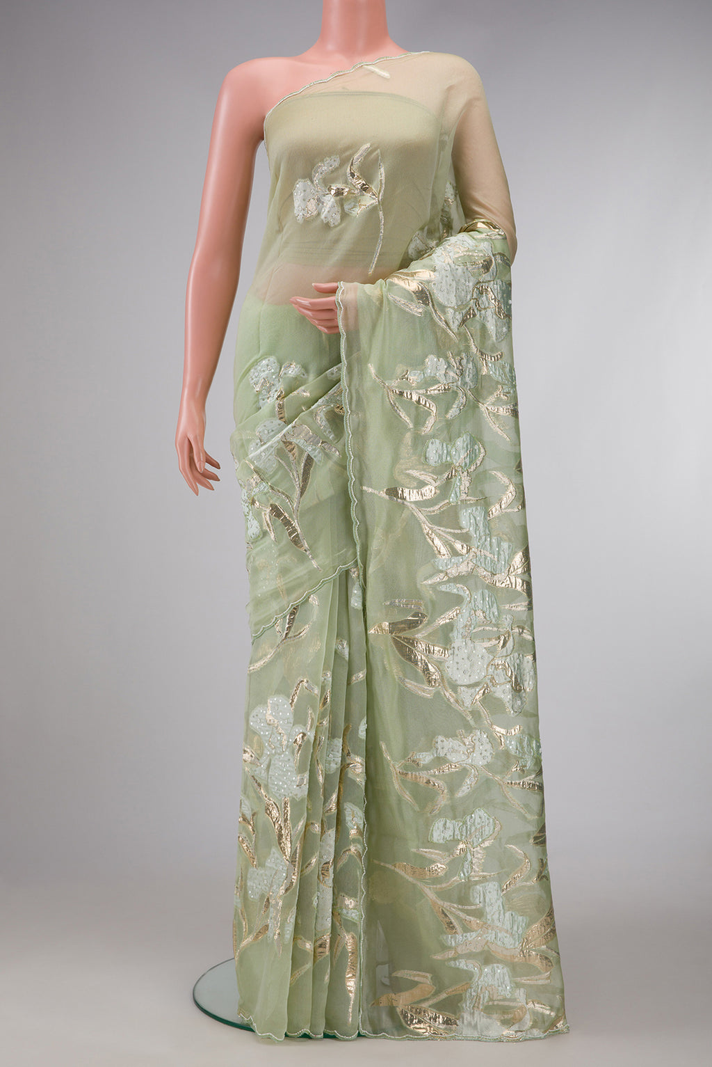 Pista Green Dual Tone Organza Silk Saree with Embroidery on the body and Embroidery Border.  displayed on a mannequin