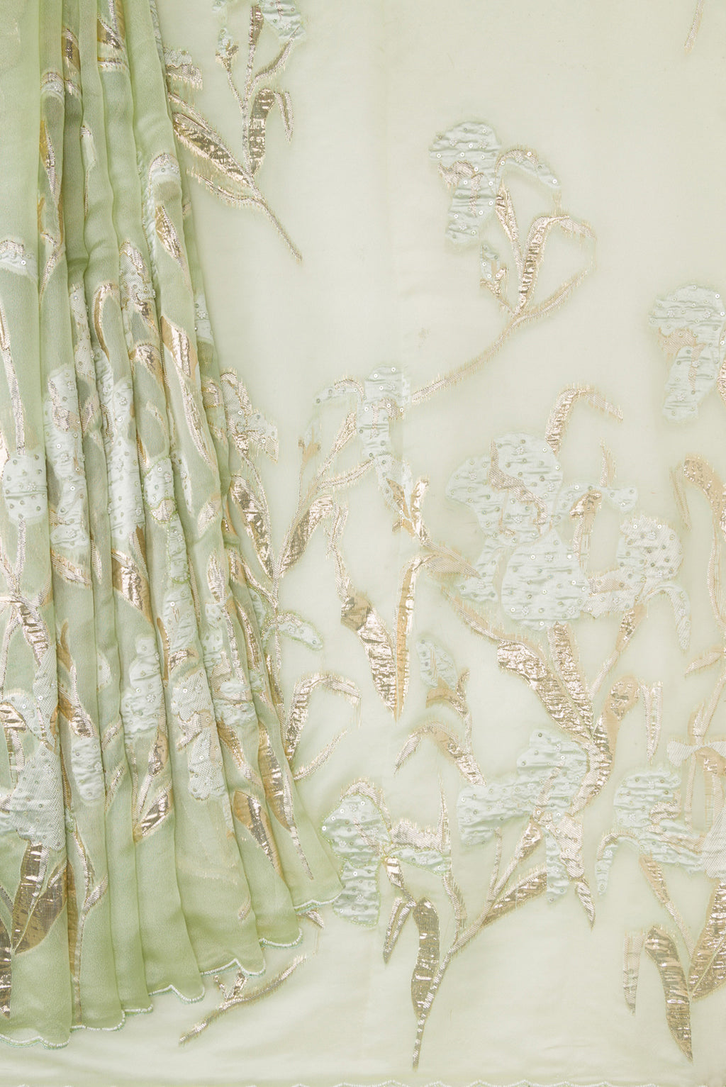 Pleats and pallu of Pista Green Dual Tone Organza Silk Saree with Embroidery on the body and Embroidery Border. 