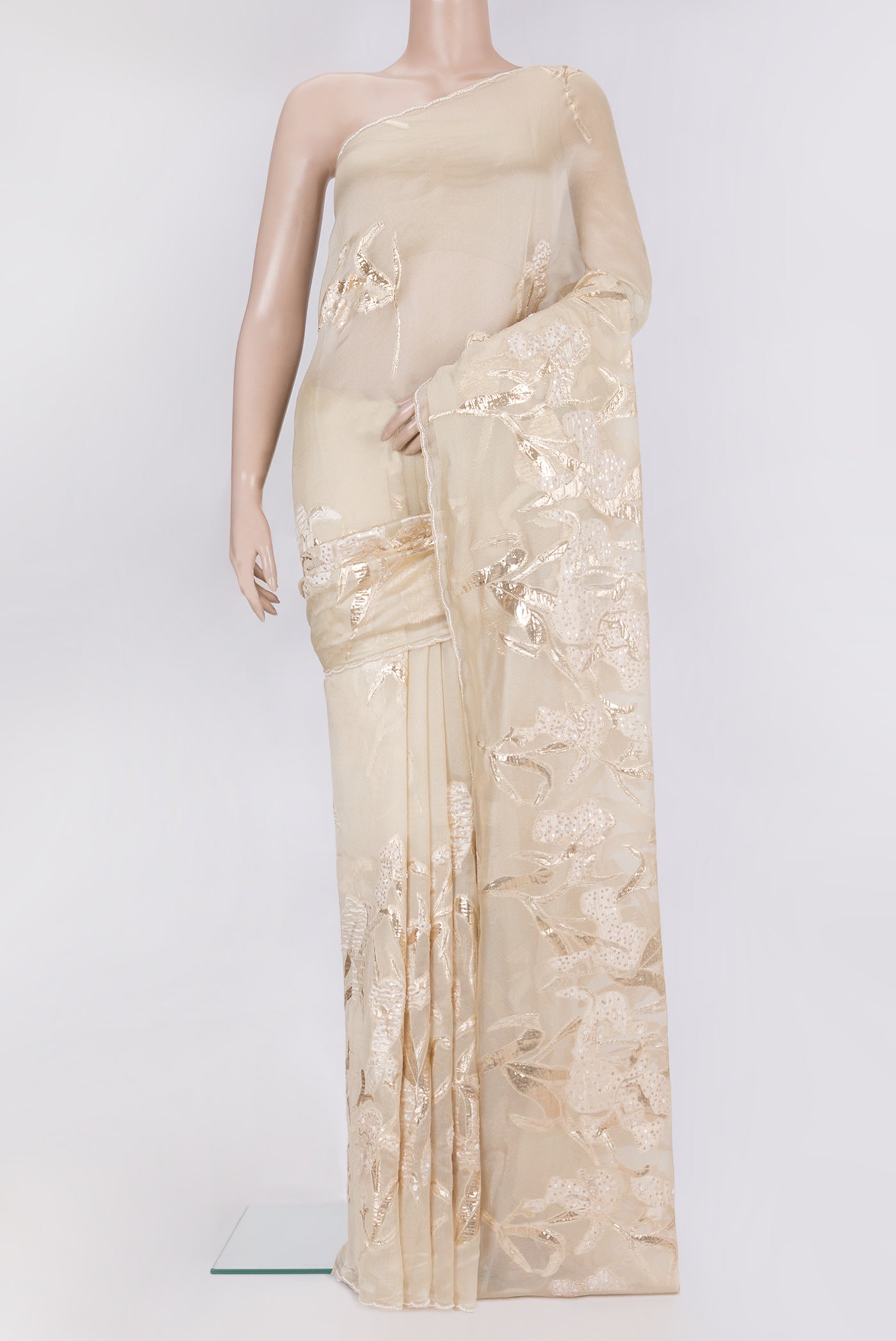 Pure Silk Beige Organza Saree with Embroidery on the body and Embroidery Border.  displayed on a mannequin