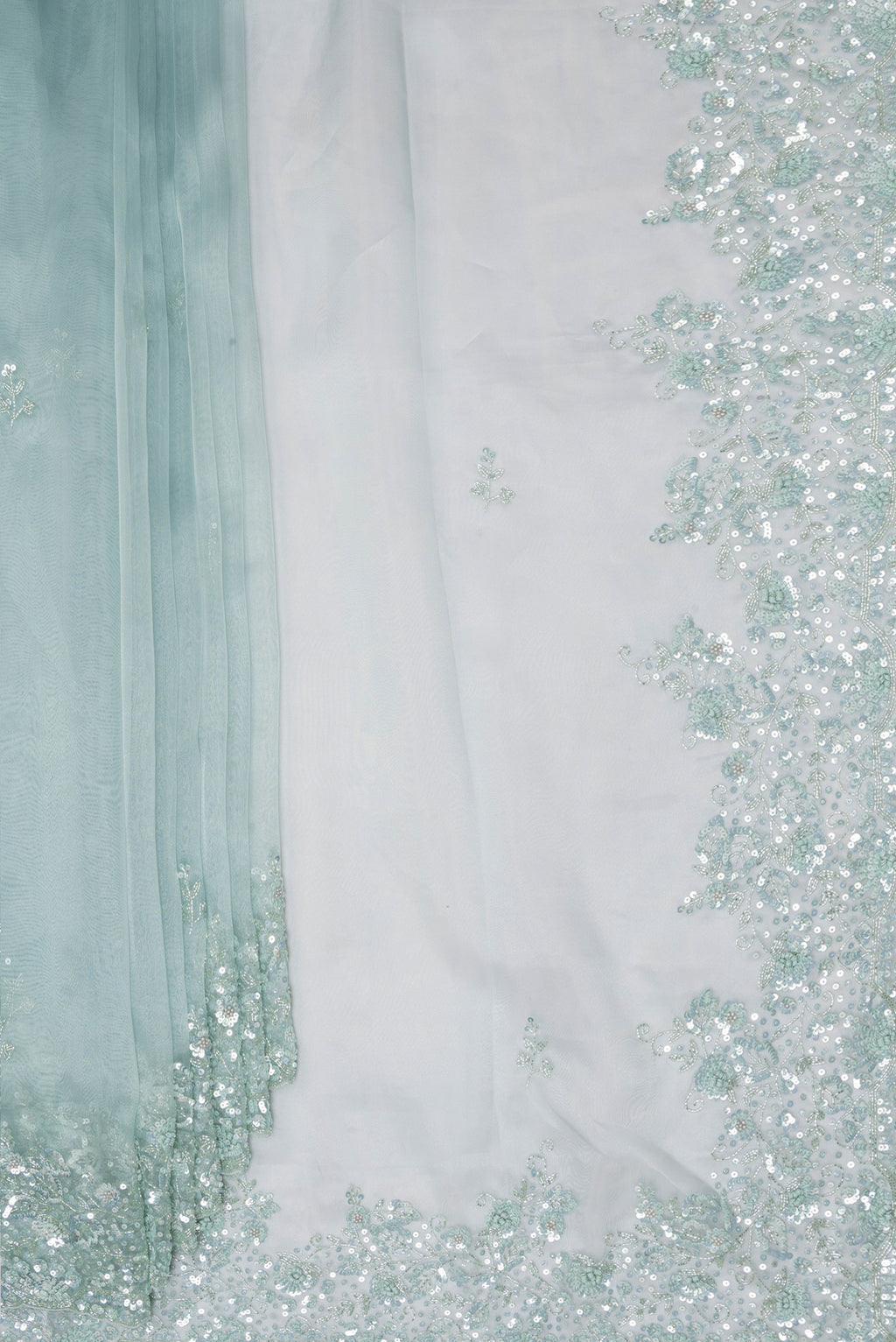 Pleats and pallu of Pure Silk Light Blue Organza Saree with Embroidery on the body and Embroidery Border. 