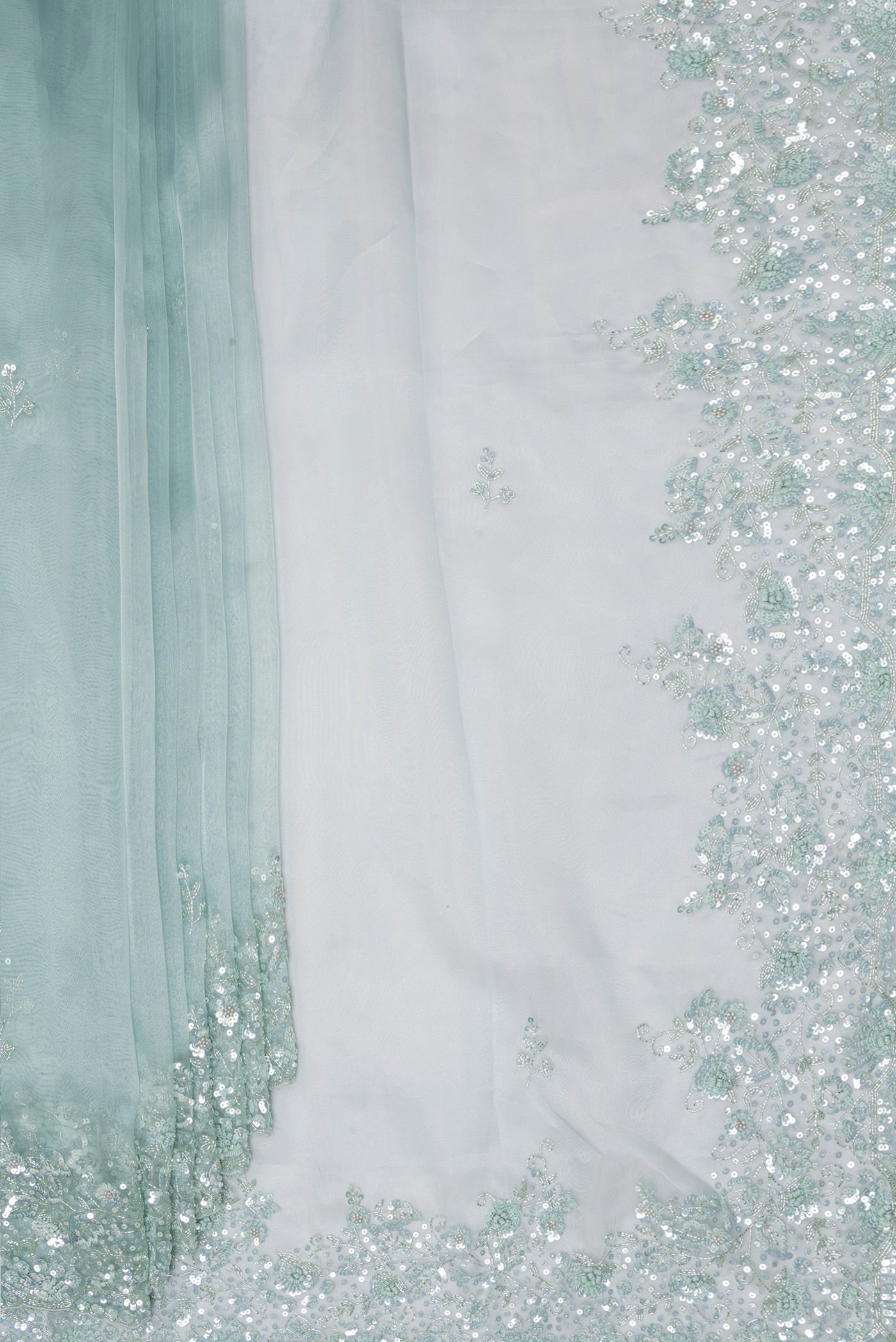 Pleats and pallu of Pure Silk Light Blue Organza Saree with Embroidery on the body and Embroidery Border. 
