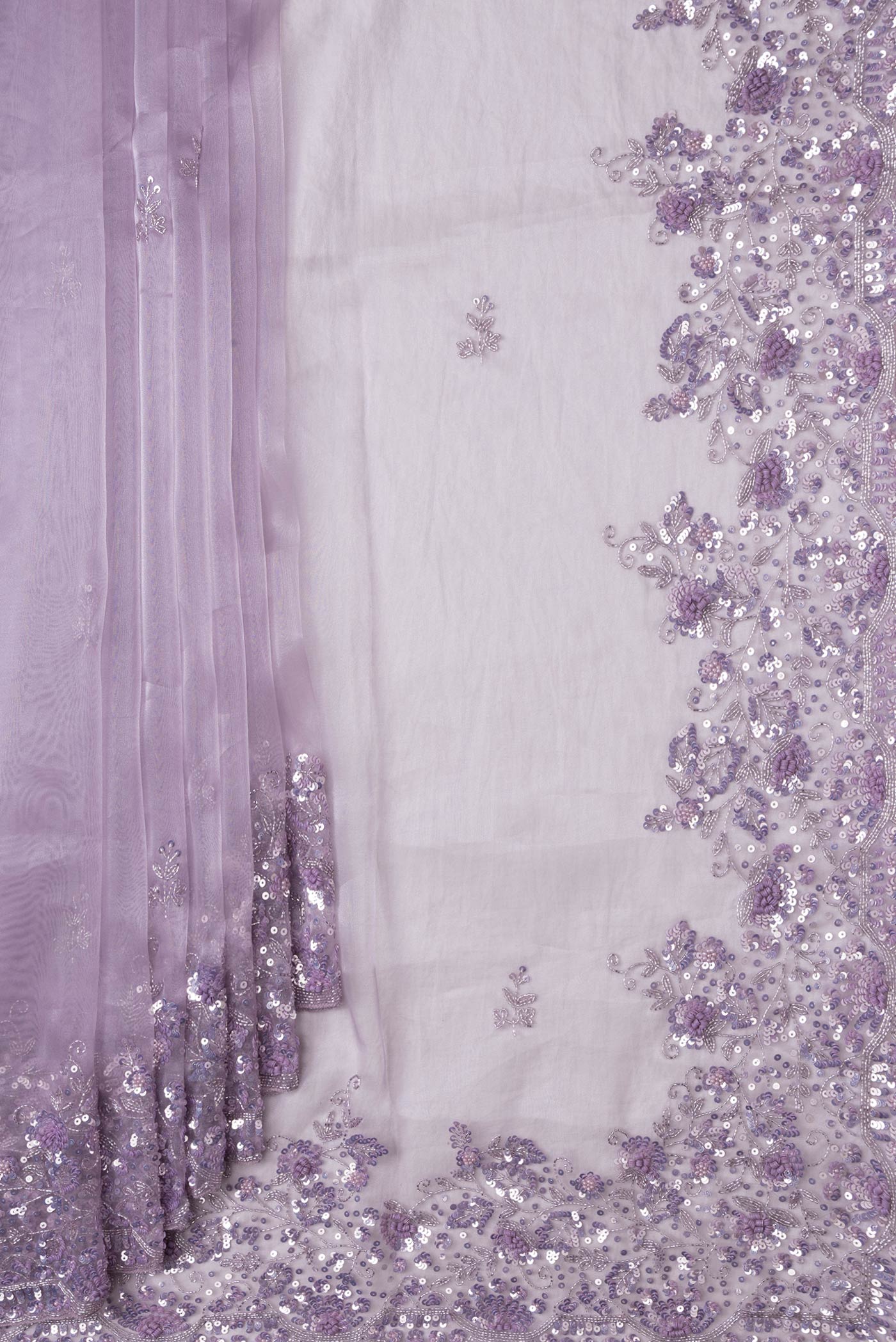 Pleats and pallu of Lavender Dual Tone Organza Silk Saree with Embroidery on the body and Embroidery Border. 