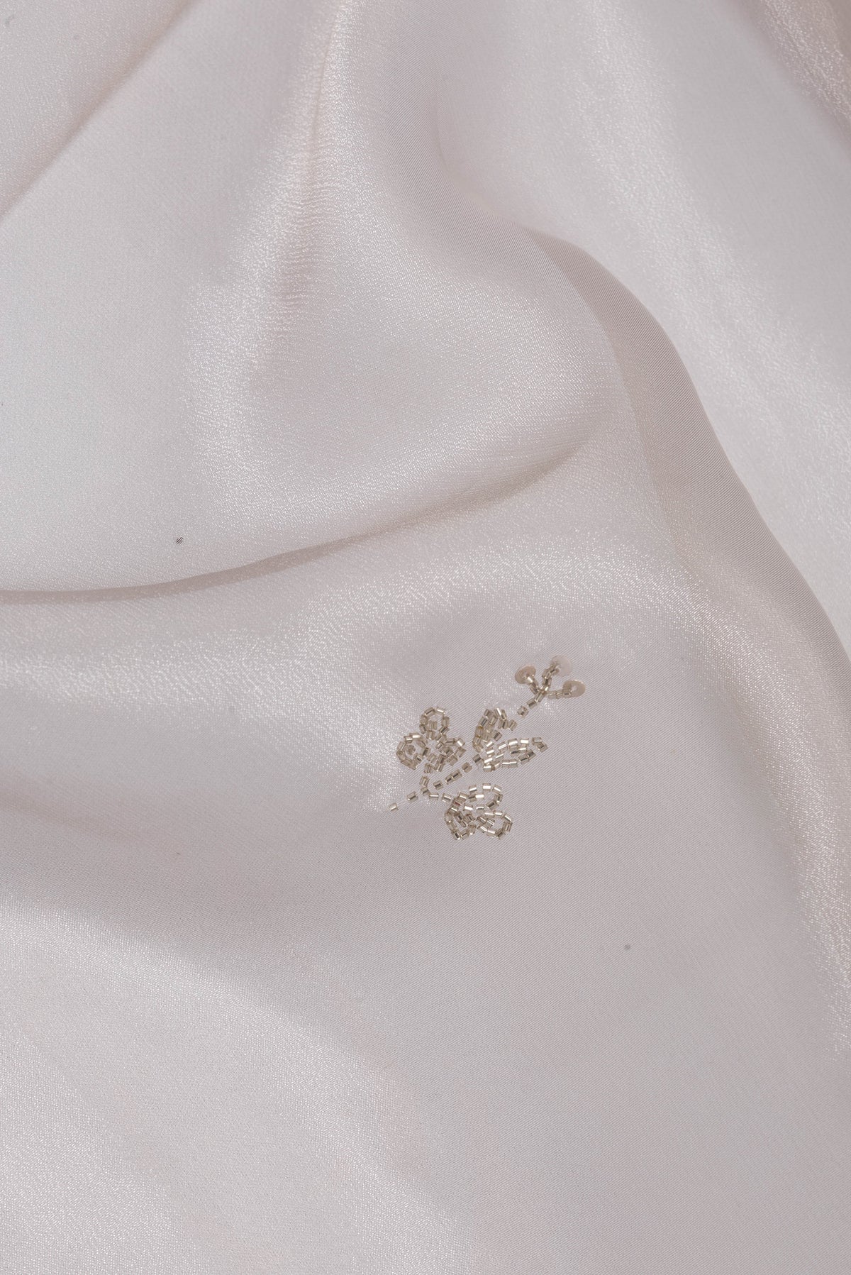 Close up of Lilac Dual Tone Organza Saree with Embroidery on the body and Embroidery Border.  displaying folds