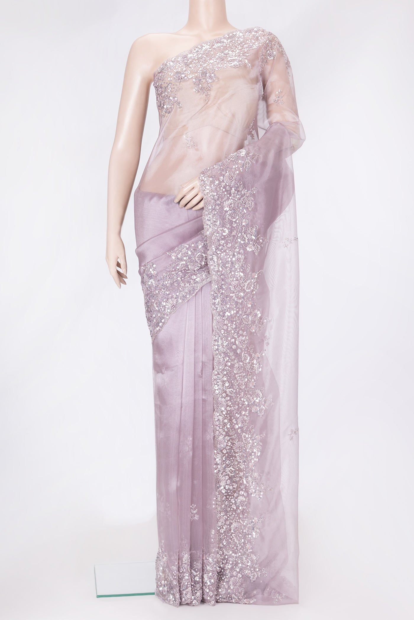 Lilac Dual Tone Organza Silk Saree with Embroidery on the body and Embroidery Border.  displayed on a mannequin