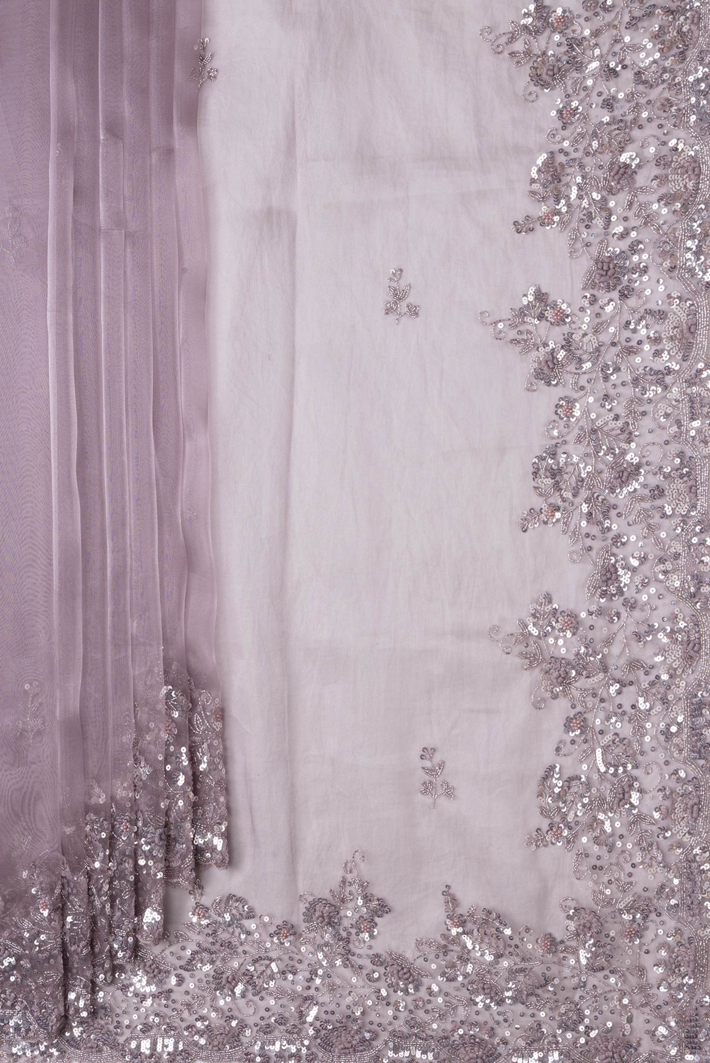 Pleats and pallu of Lilac Dual Tone Organza Silk Saree with Embroidery on the body and Embroidery Border. 