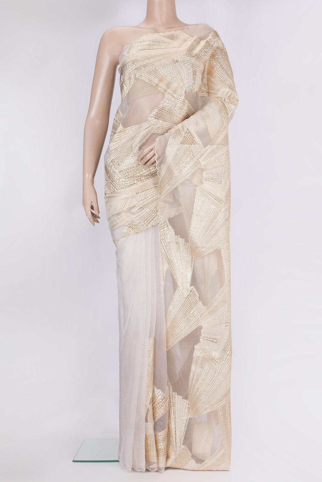Beige Organza Silk Saree with Fancy on the body and Sequin Border.  displayed on a mannequin