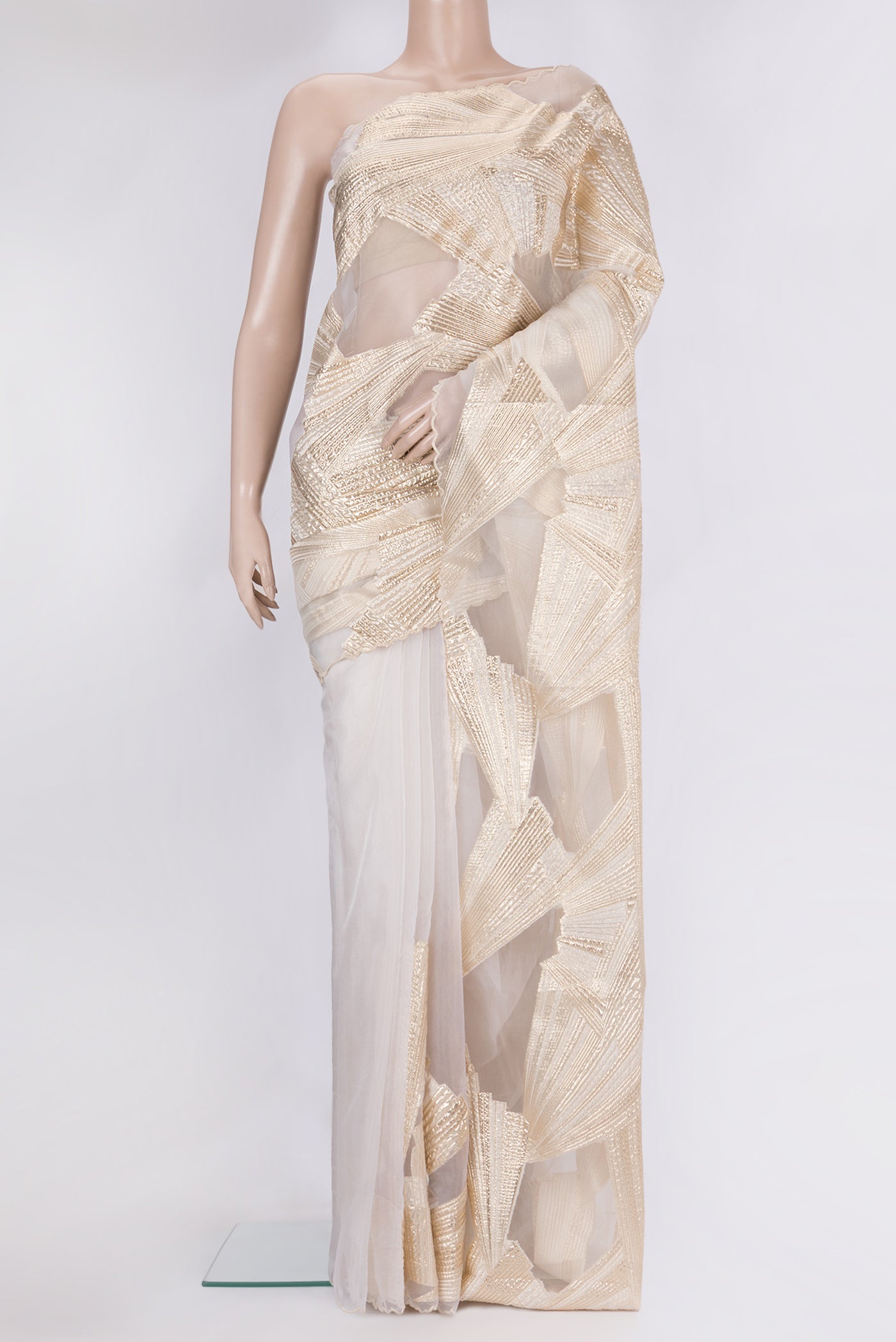 Beige Organza Silk Saree with Fancy on the body and Sequin Border.  displayed on a mannequin