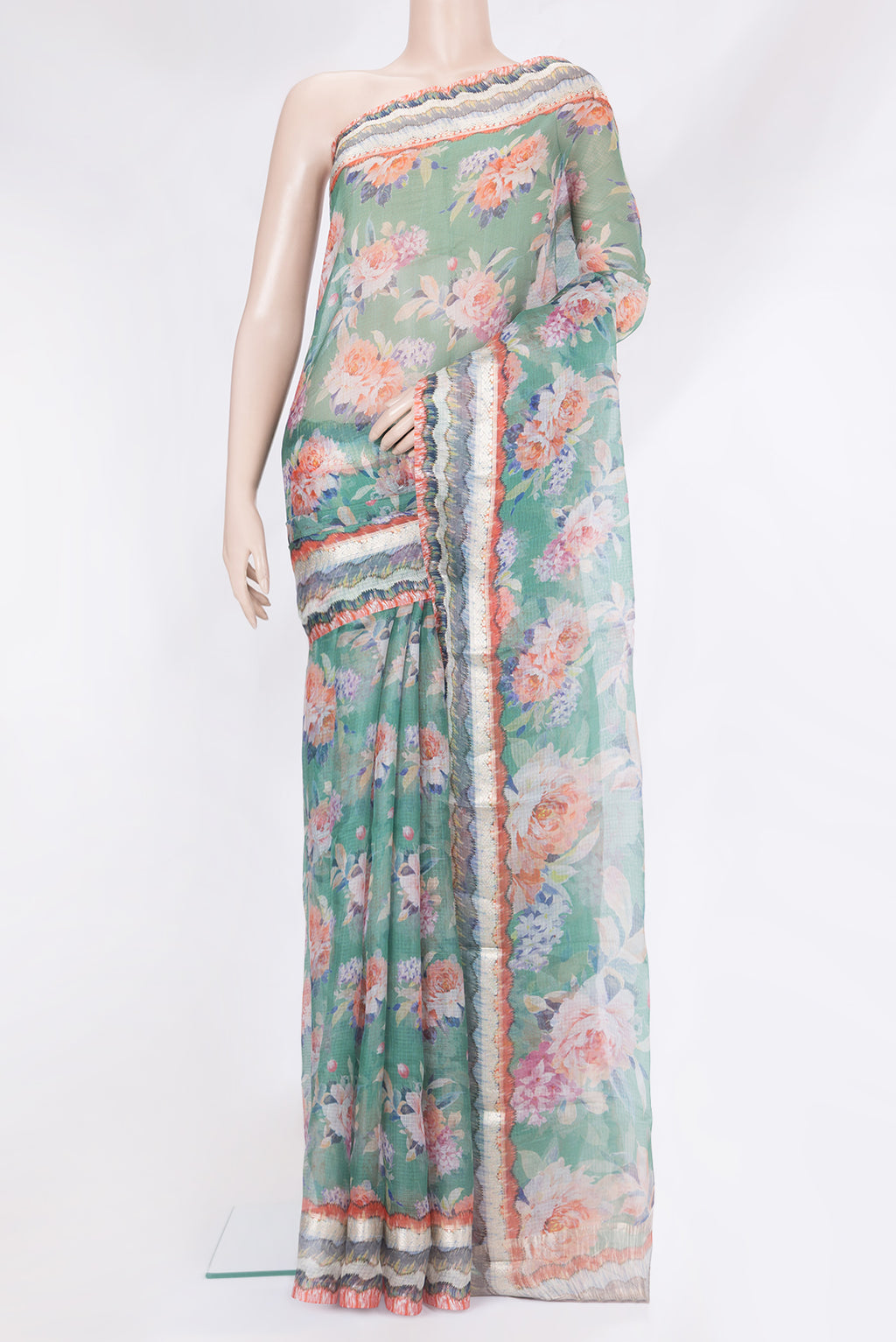 Green Kota Silk Saree with Printed design on the body and Fancy Border.  displayed on a mannequin