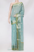 Light Blue Blended Tussar Silk Saree with Zari Butta on the body and Fancy Border.  displayed on a mannequin