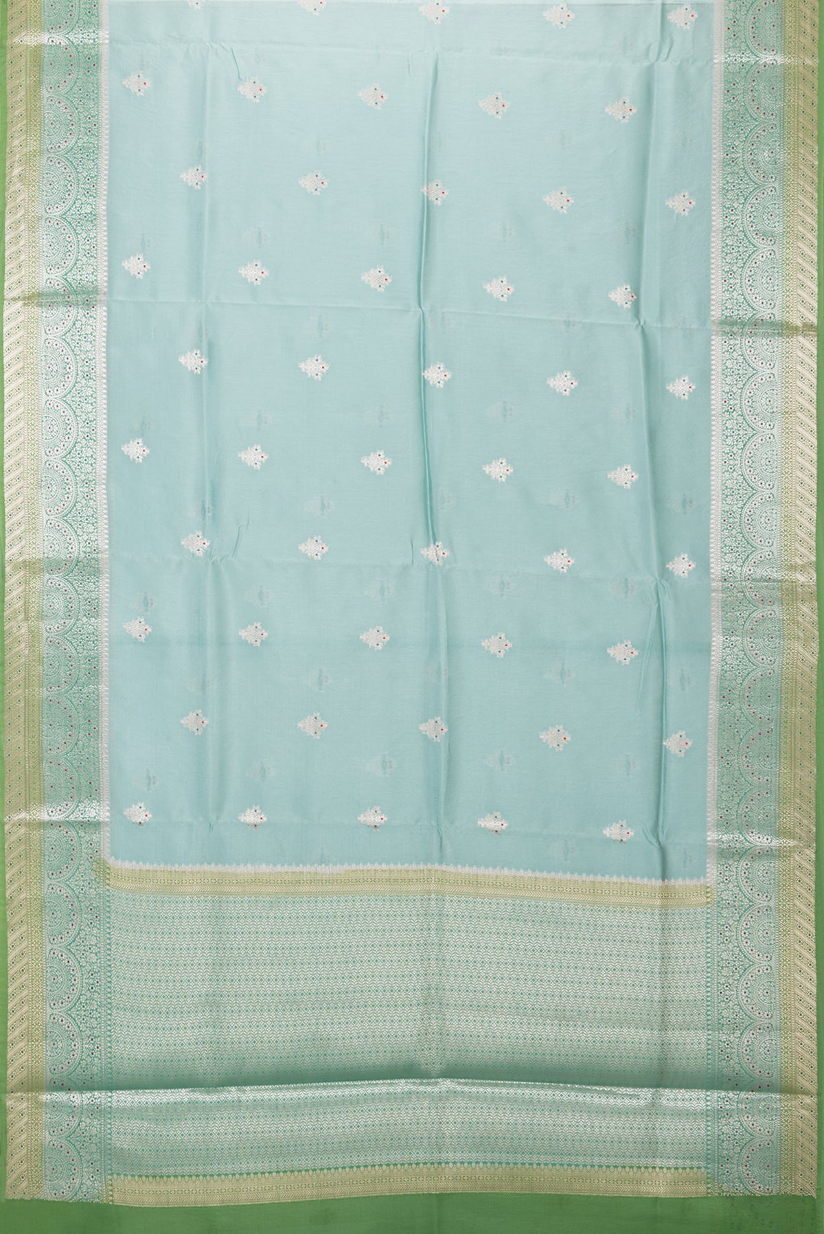 Flat view of Light Blue Blended Tussar Silk Saree with Zari Butta on the body and Fancy Border. 