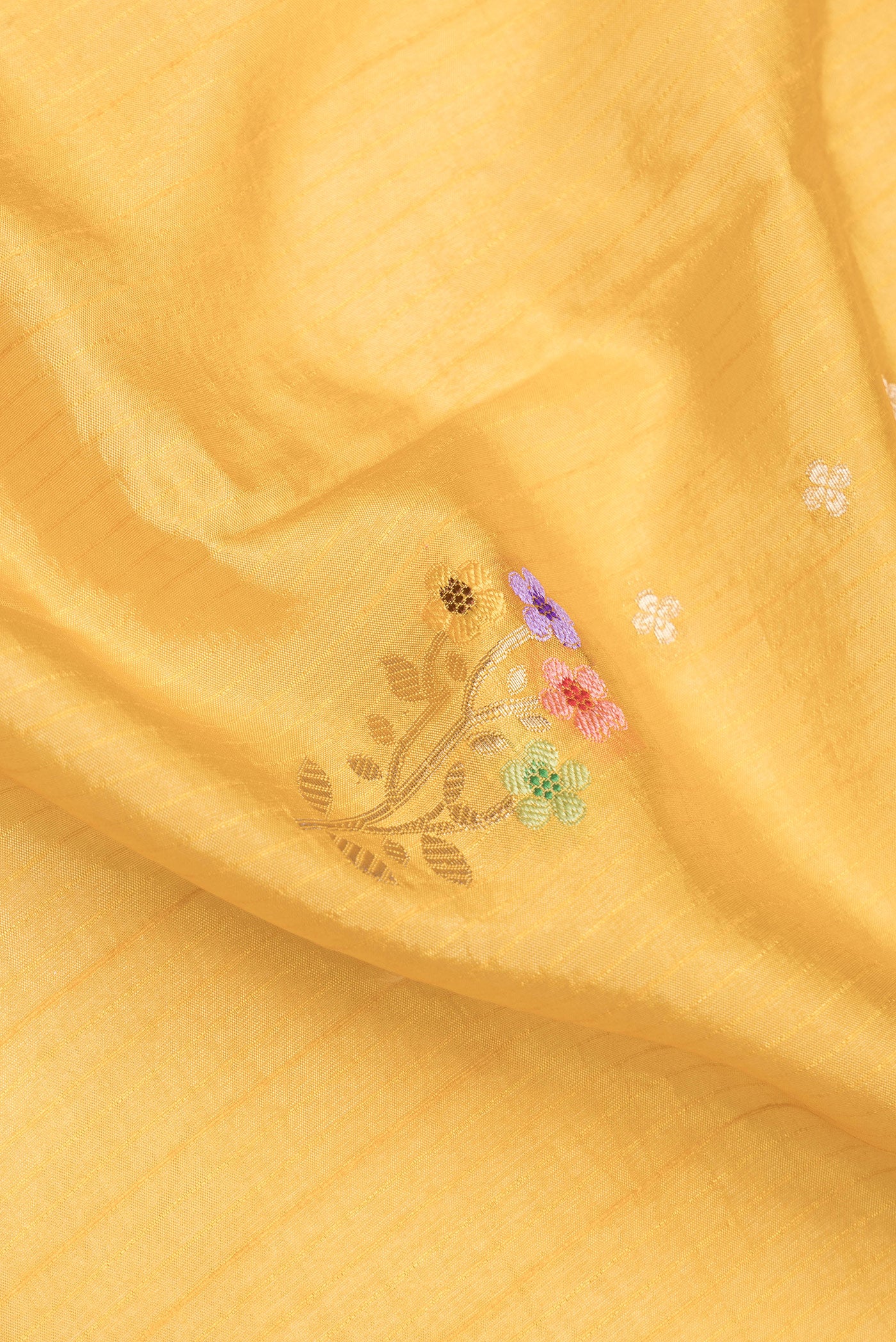 Close up of Mustard Dual Tone Tussar Silk Saree with Zari Butta on the body and Zari And Thread Border.  displaying folds