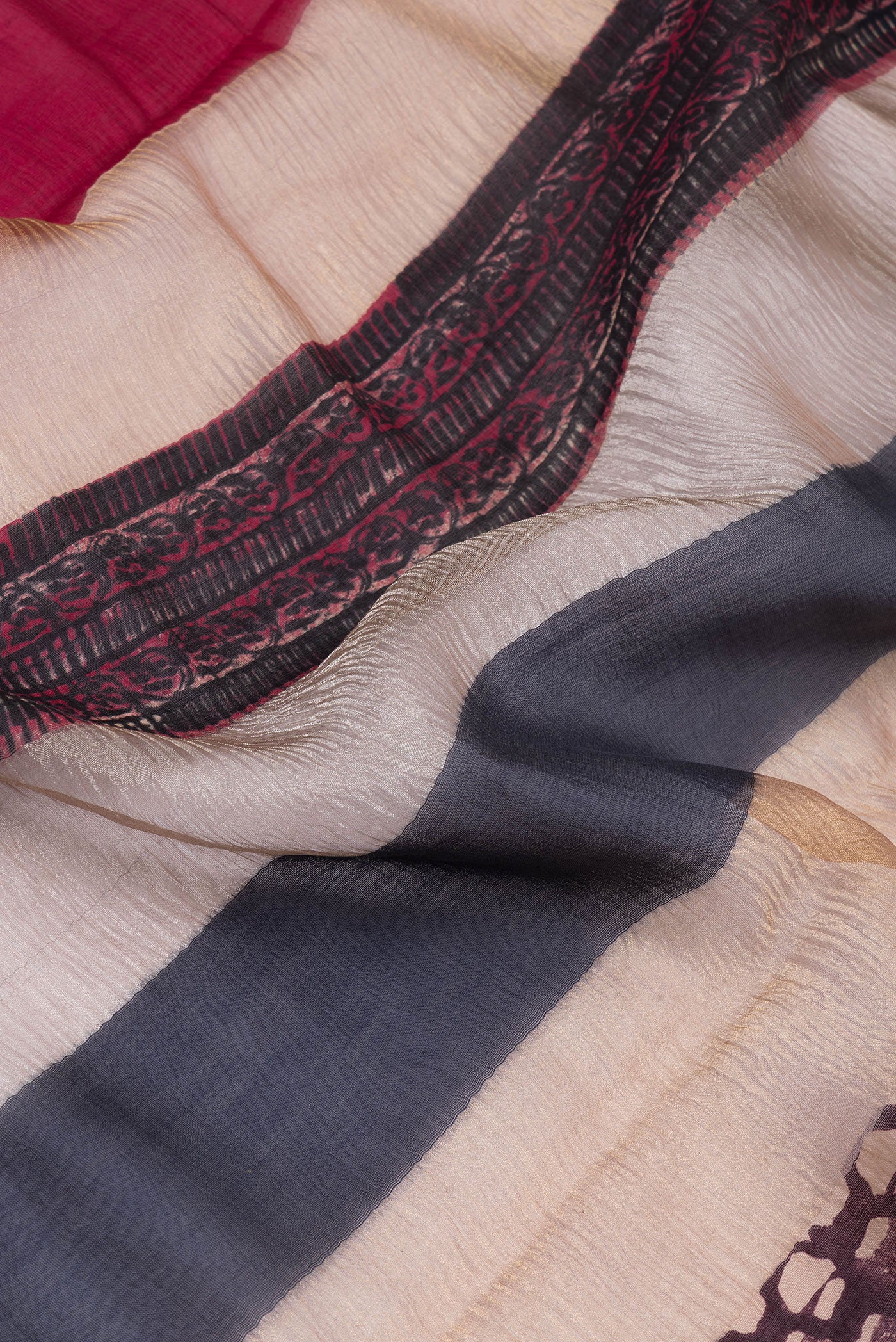 Close up of Beige Tussar Silk Saree with Stripes on the body and Zari Border.  displaying folds