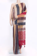 Beige Tussar Silk Saree with Stripes on the body and Zari Border.  displayed on a mannequin