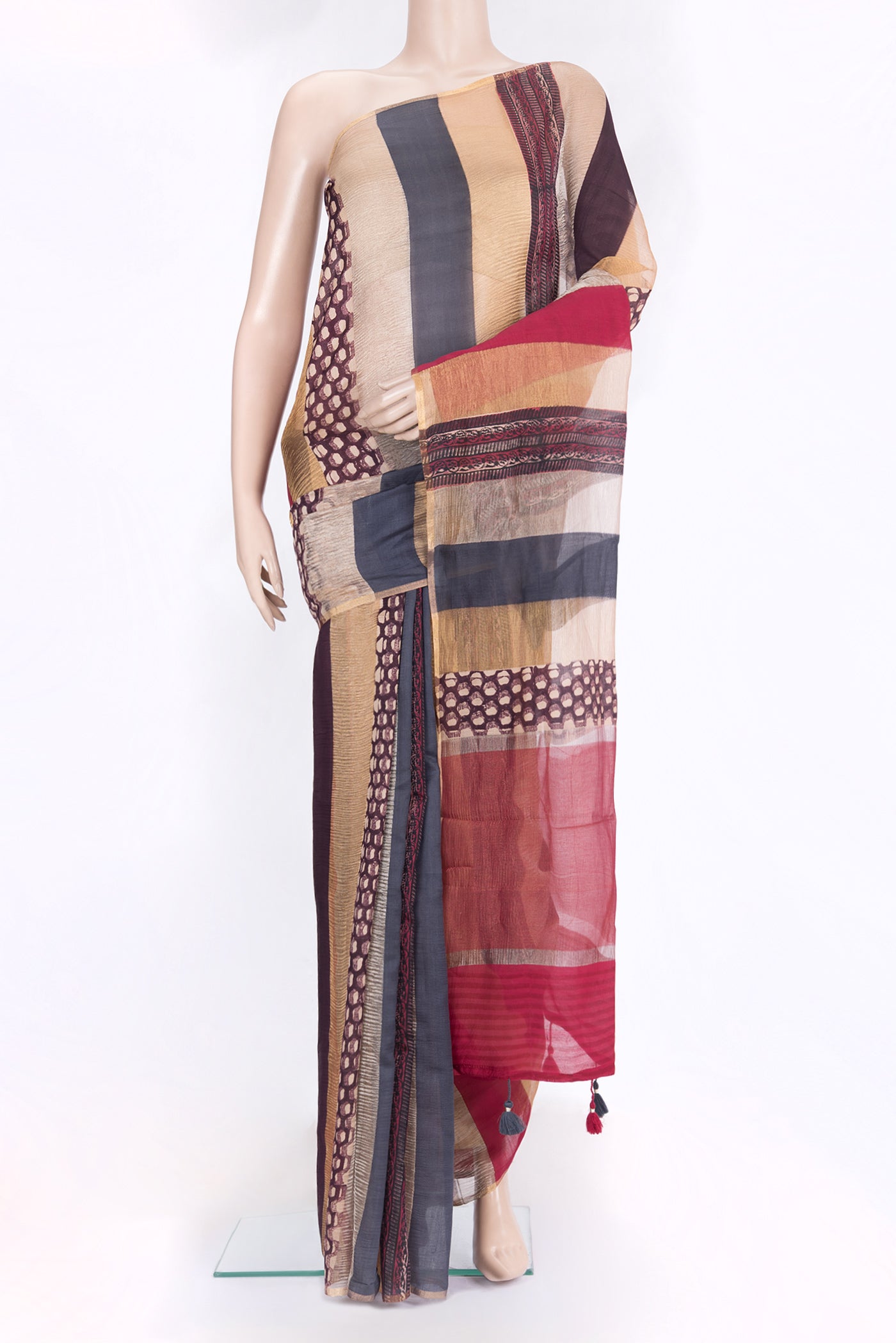 Beige Tussar Silk Saree with Stripes on the body and Zari Border.  displayed on a mannequin