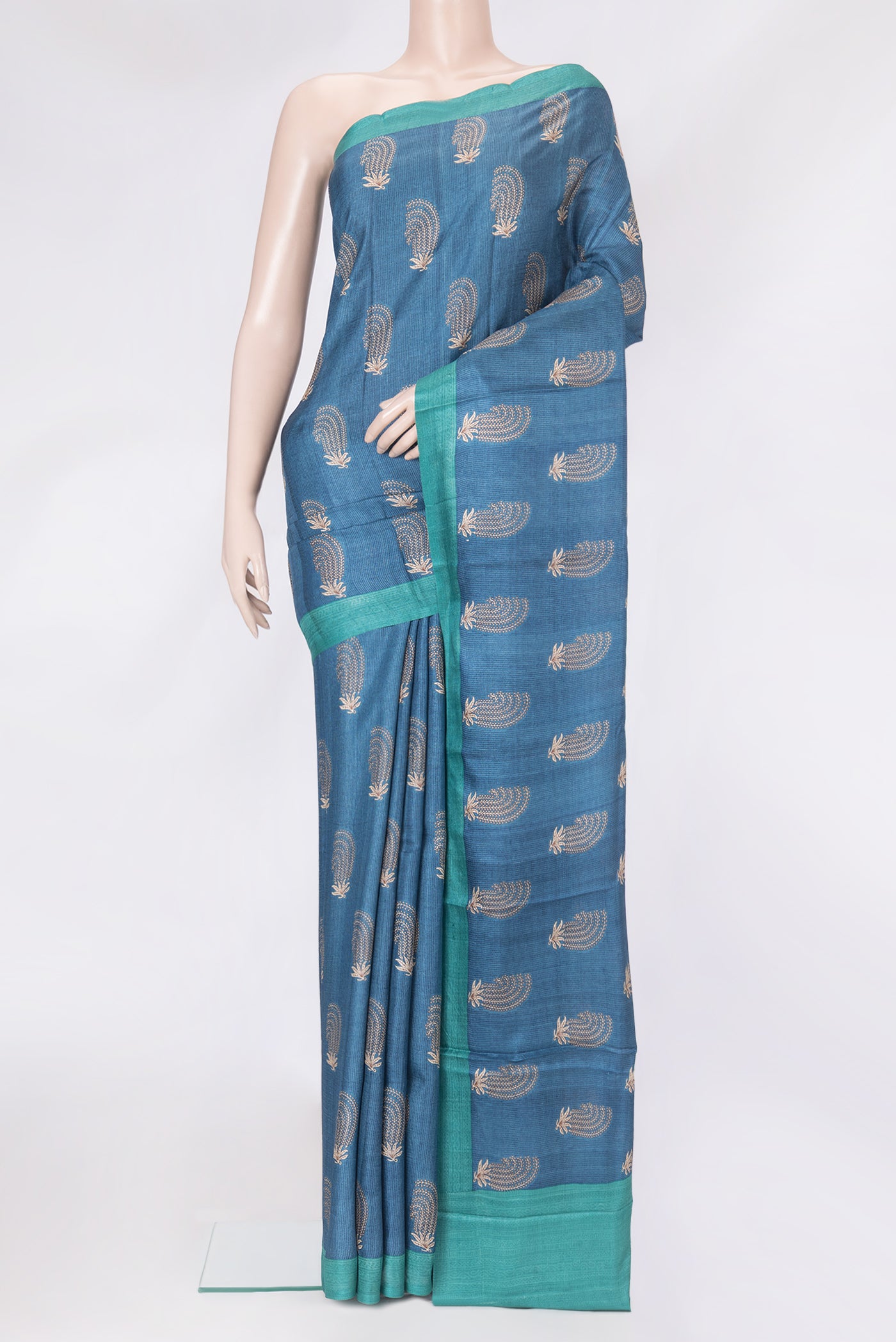 Blue Dual Tone Tussar Silk Saree with Printed design on the body and Plain Border.  displayed on a mannequin