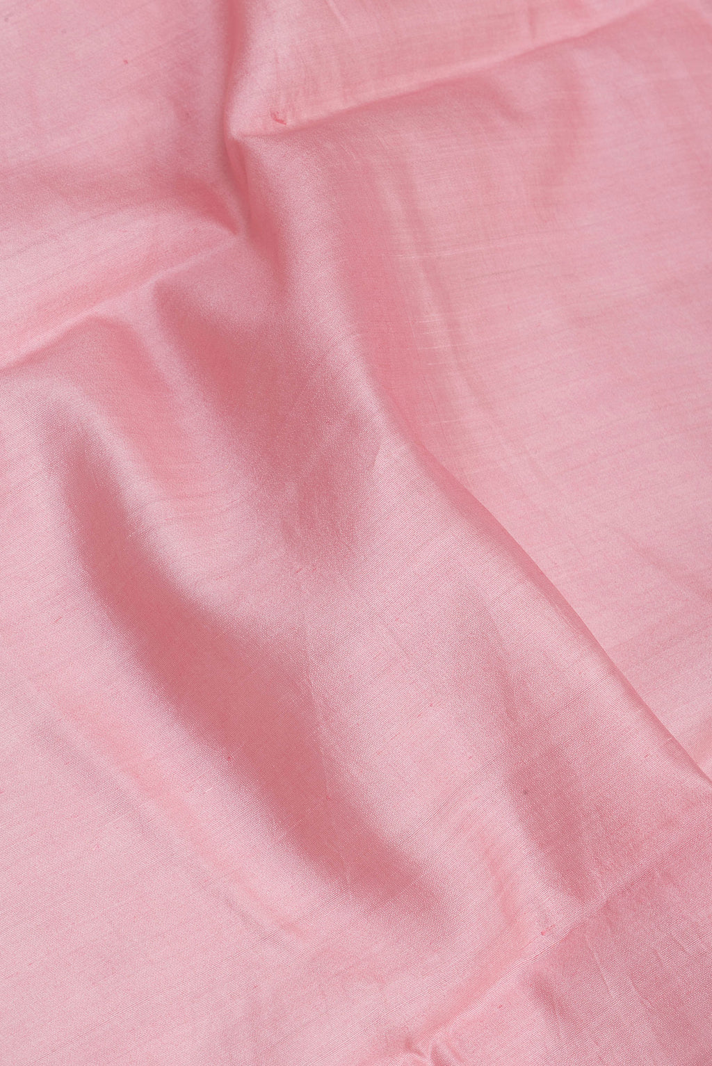 Close up of Rose pink Dual Tone Tussar Silk Saree with Plain Body and Zari Border.  displaying folds