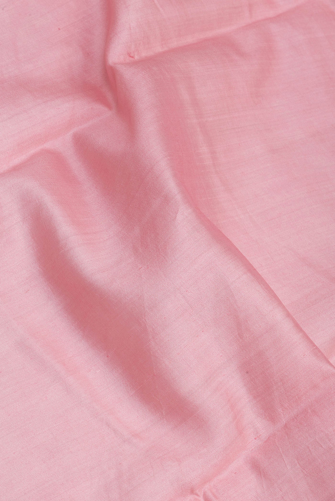 Close up of Rose pink Dual Tone Tussar Silk Saree with Plain Body and Zari Border.  displaying folds