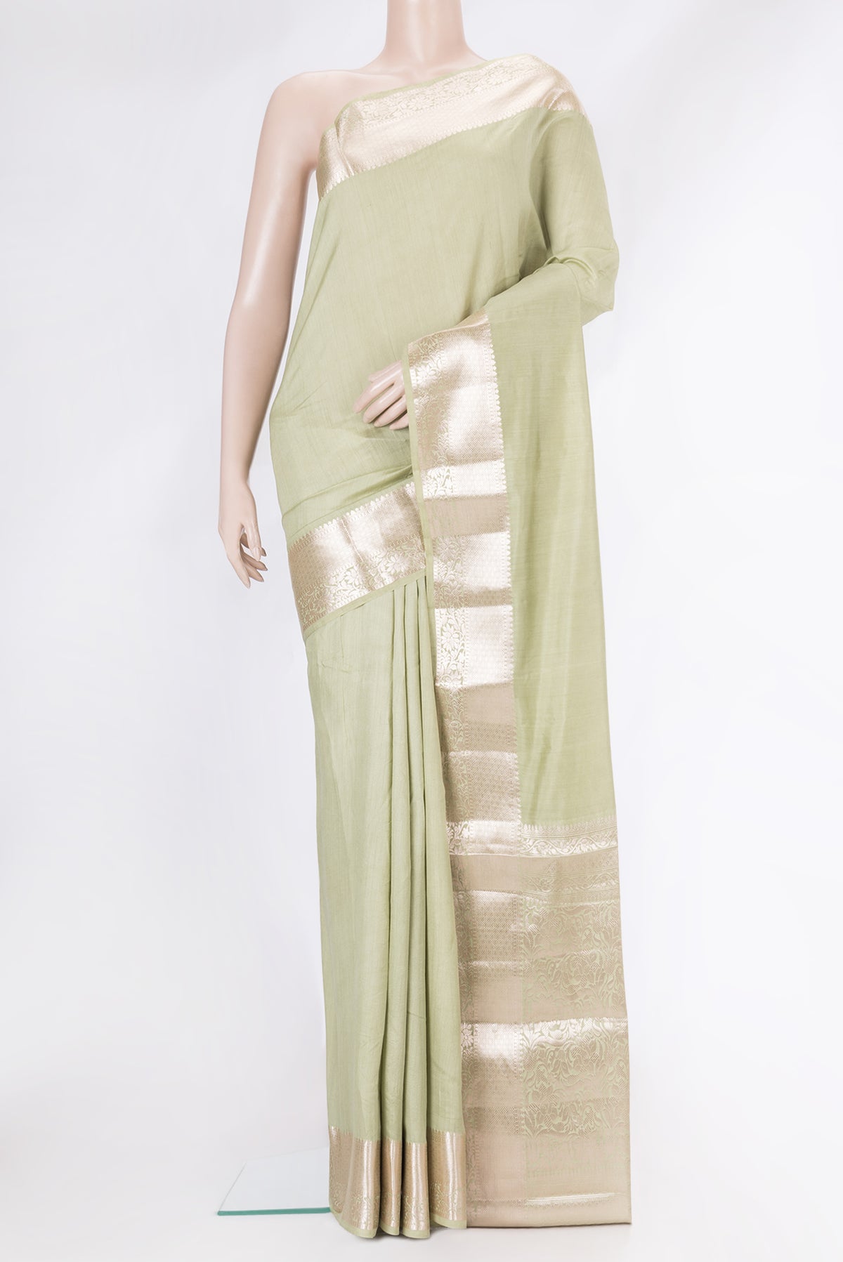 Pista Green Dual Tone Tussar Silk Saree with Plain Body and Zari Border.  displayed on a mannequin