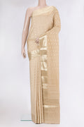 Beige Tussar Silk Saree with Zari Butta on the body and Zari Border.  displayed on a mannequin
