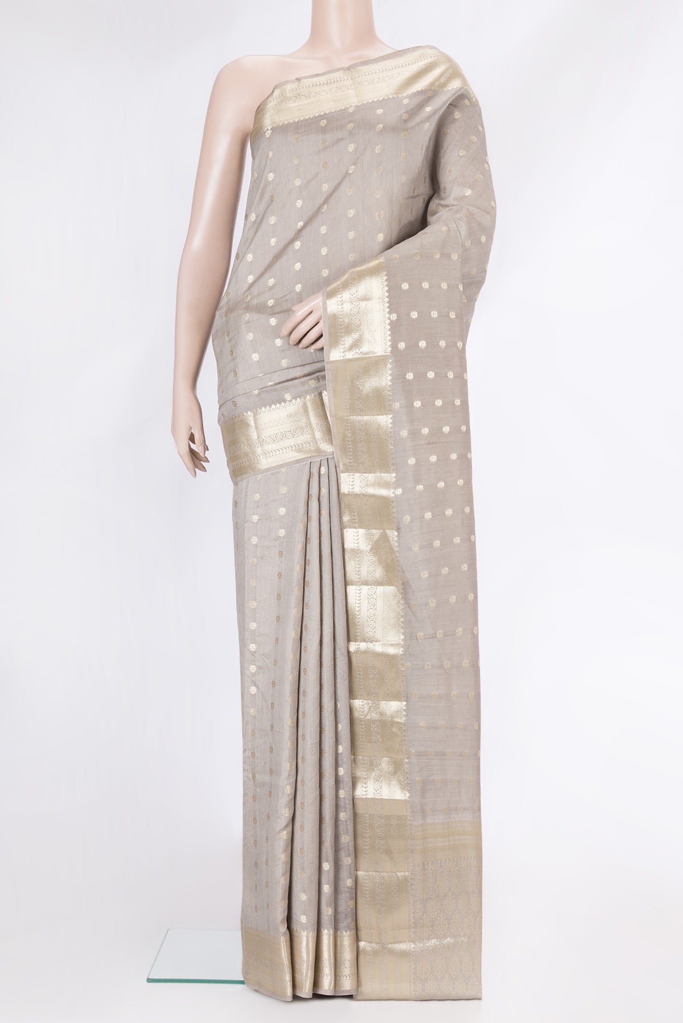 Grey Dual Tone Tussar Silk Saree with Zari Butta on the body and Zari Border.  displayed on a mannequin