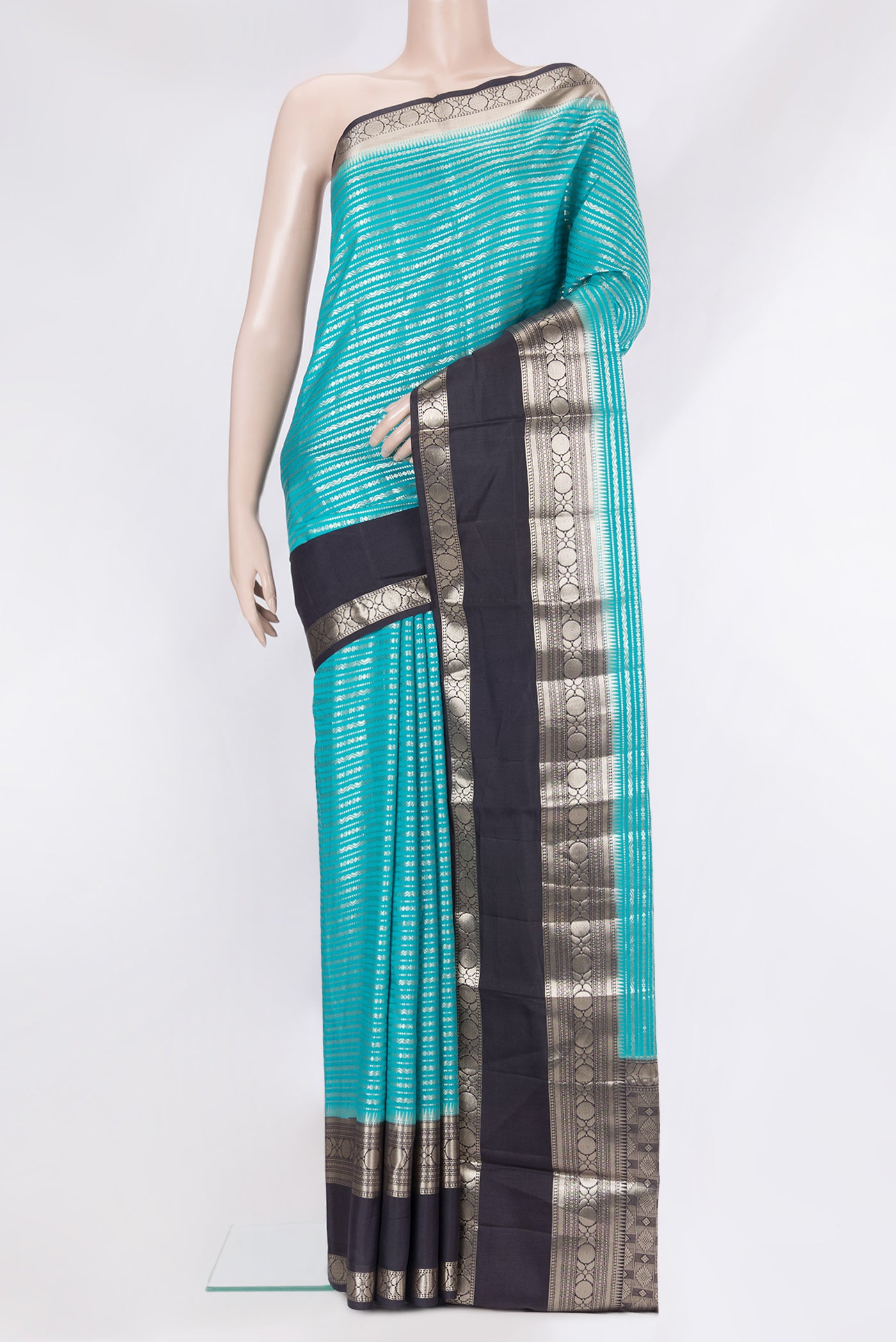 Peacock Blue Tussar Silk Saree with Zari Brocade on the body and Zari Border.  displayed on a mannequin
