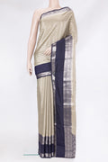 Beige Tussar Silk Saree with Zari Brocade on the body and Zari Border.  displayed on a mannequin