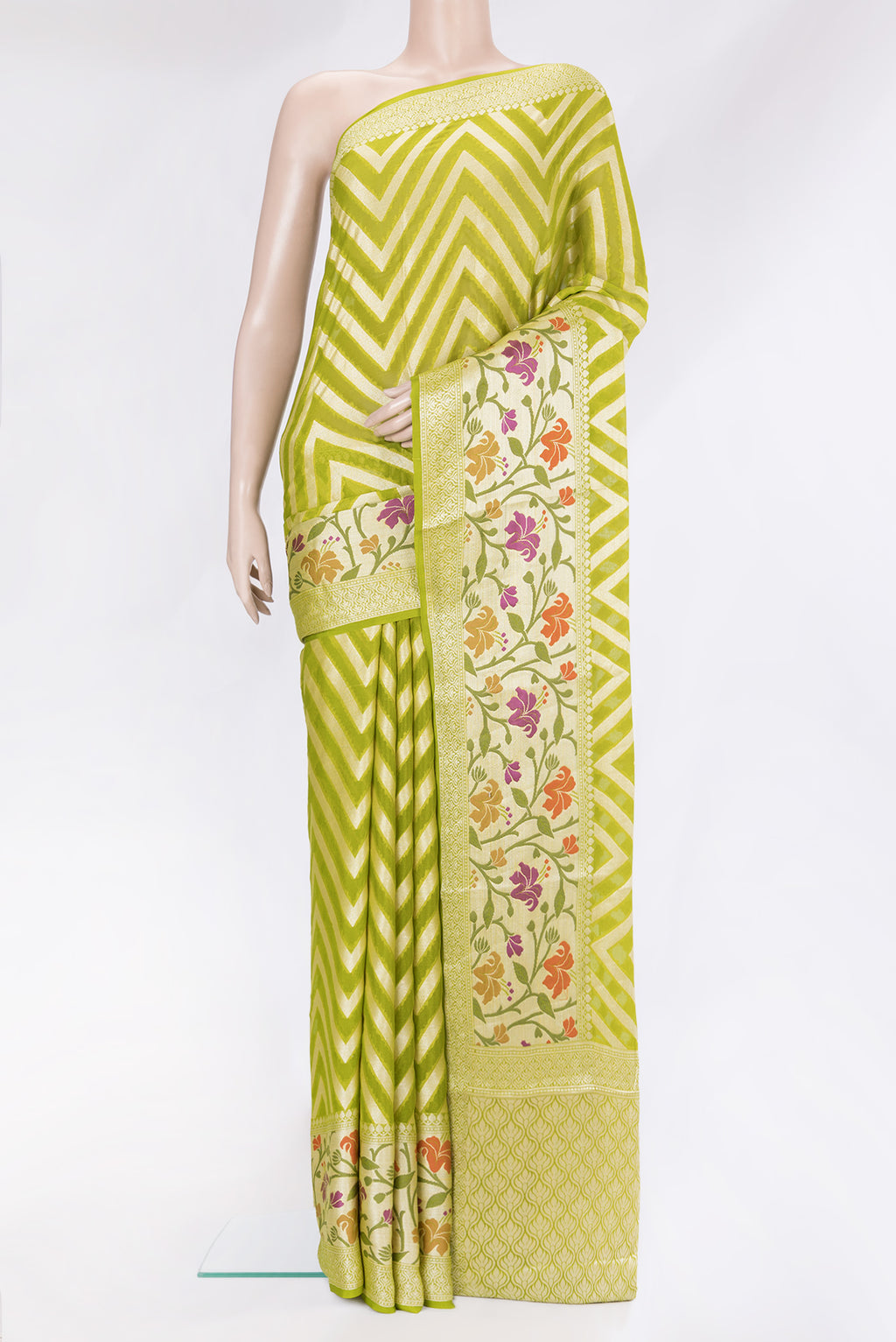 Parrot Green Banarasi Georgette Saree with Zig Zag design on the body and Zari Border.  displayed on a mannequin
