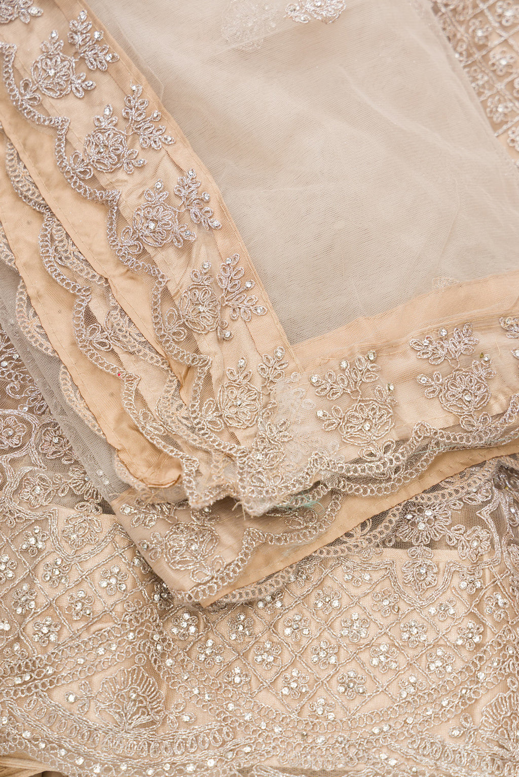 Close up blouse image of Caramel Raw Silk Womens Lehenga set featuring Embroidered Choli paired with Caramel Embroidered Skirt with Embroidered Border and a Embroidered dupatta in Caramel