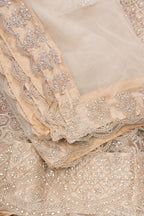 Close up blouse image of Caramel Raw Silk Womens Lehenga set featuring Embroidered Choli paired with Caramel Embroidered Skirt with Embroidered Border and a Embroidered dupatta in Caramel