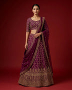 Burgundy Banarasi Silk Womens Lehenga set featuring Embroidered Choli paired with Burgundy Embroidered Skirt with Embroidered Border and a Embroidered dupatta in Burgundy