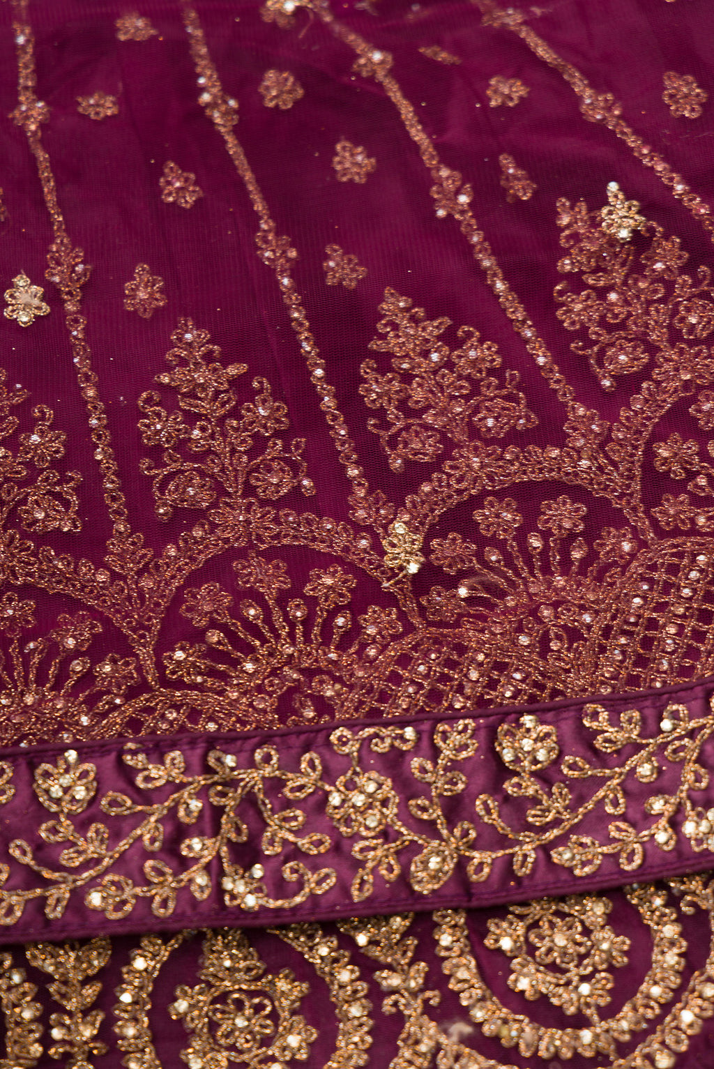 Close up blouse image of Burgundy Banarasi Silk Womens Lehenga set featuring Embroidered Choli paired with Burgundy Embroidered Skirt with Embroidered Border and a Embroidered dupatta in Burgundy