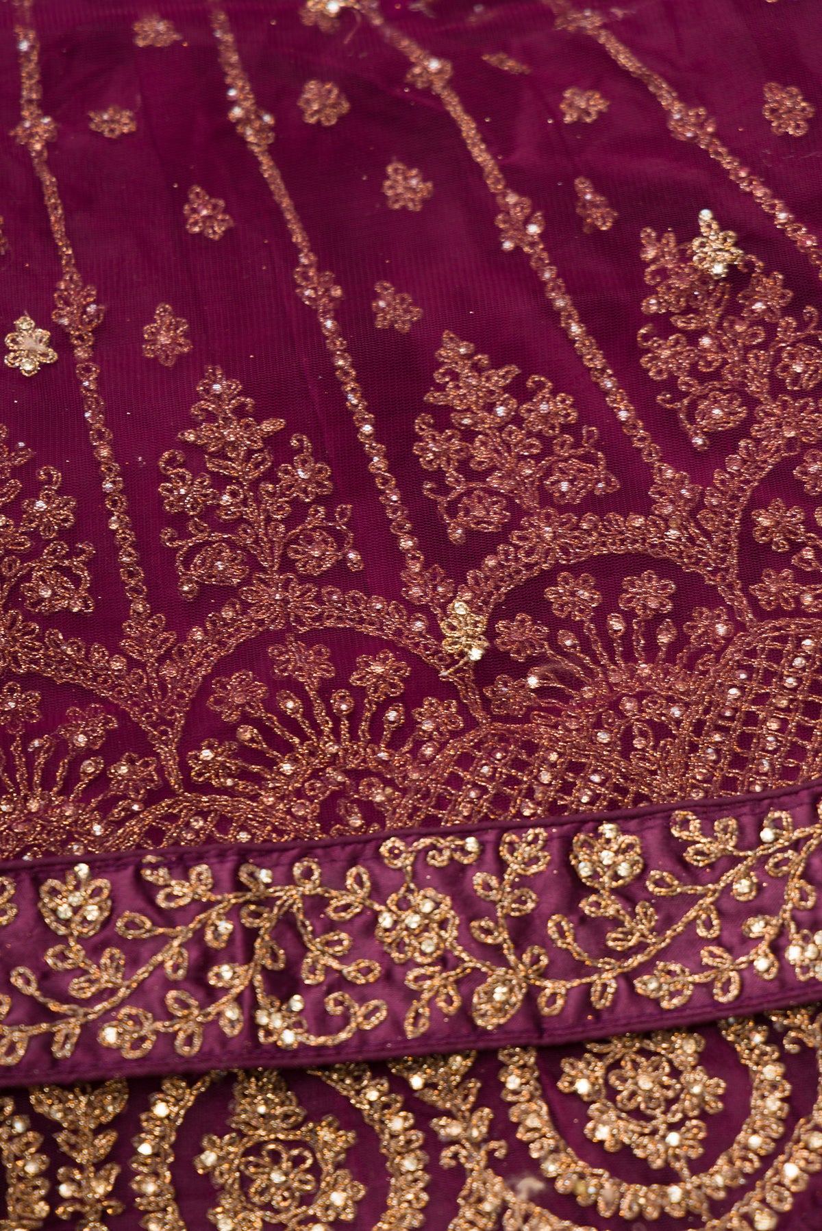 Close up blouse image of Burgundy Banarasi Silk Womens Lehenga set featuring Embroidered Choli paired with Burgundy Embroidered Skirt with Embroidered Border and a Embroidered dupatta in Burgundy