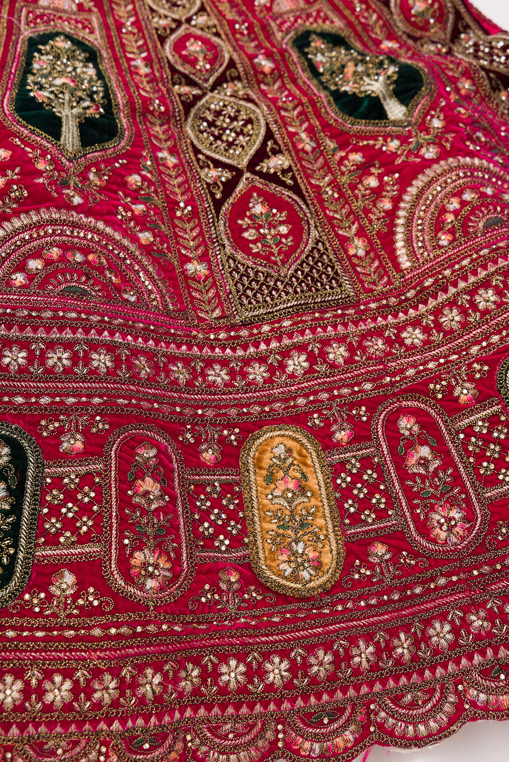 Detailed shot of Dark Pink Raw Silk Womens Lehenga set featuring Embroidered Choli paired with Dark Pink Embroidered Skirt with Embroidered Border and a Embroidered dupatta in Dark Pink