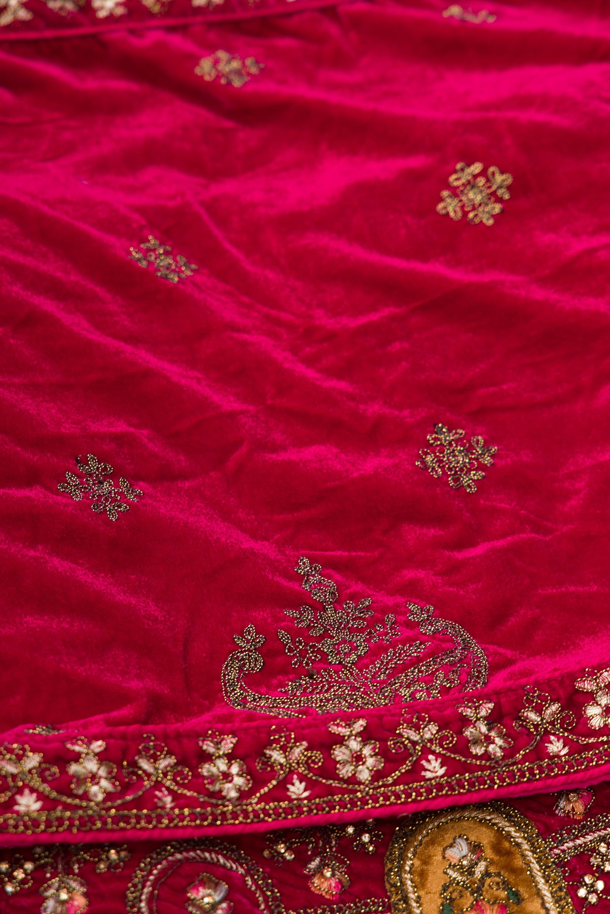 Close up blouse image of Dark Pink Raw Silk Womens Lehenga set featuring Embroidered Choli paired with Dark Pink Embroidered Skirt with Embroidered Border and a Embroidered dupatta in Dark Pink