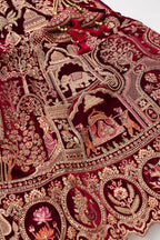 Detailed shot of Maroon Banarasi Silk Womens Lehenga set featuring Embroidered Choli paired with Maroon Embroidered Skirt with Embroidered Border and a Embroidered dupatta in Maroon
