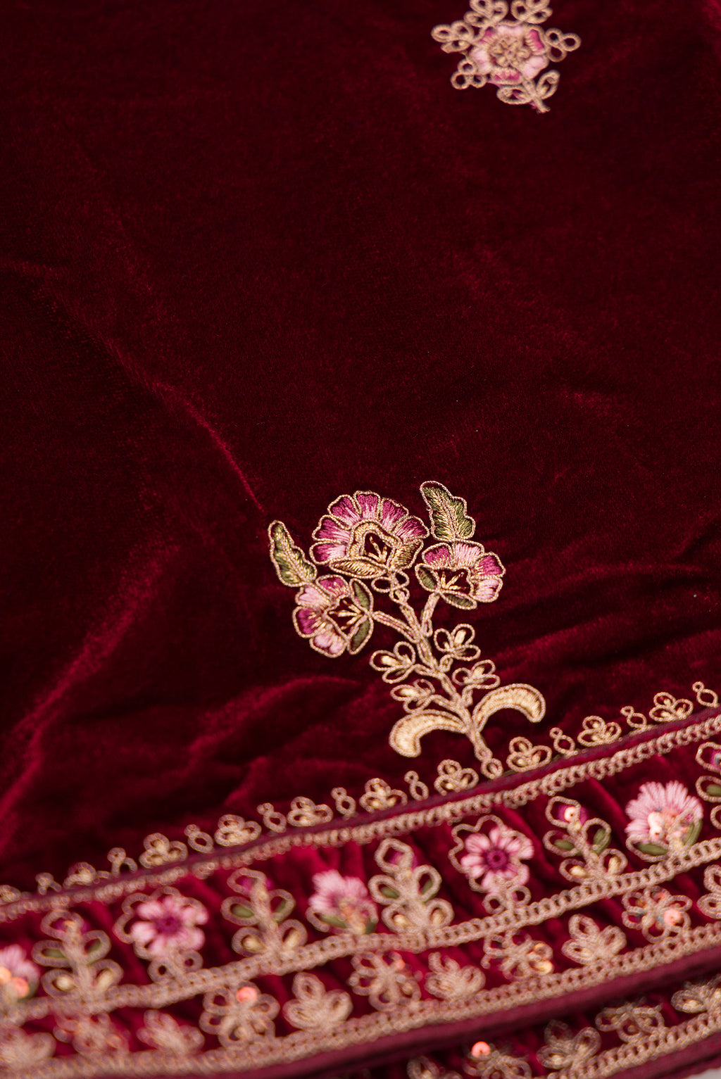 Close up blouse image of Maroon Banarasi Silk Womens Lehenga set featuring Embroidered Choli paired with Maroon Embroidered Skirt with Embroidered Border and a Embroidered dupatta in Maroon