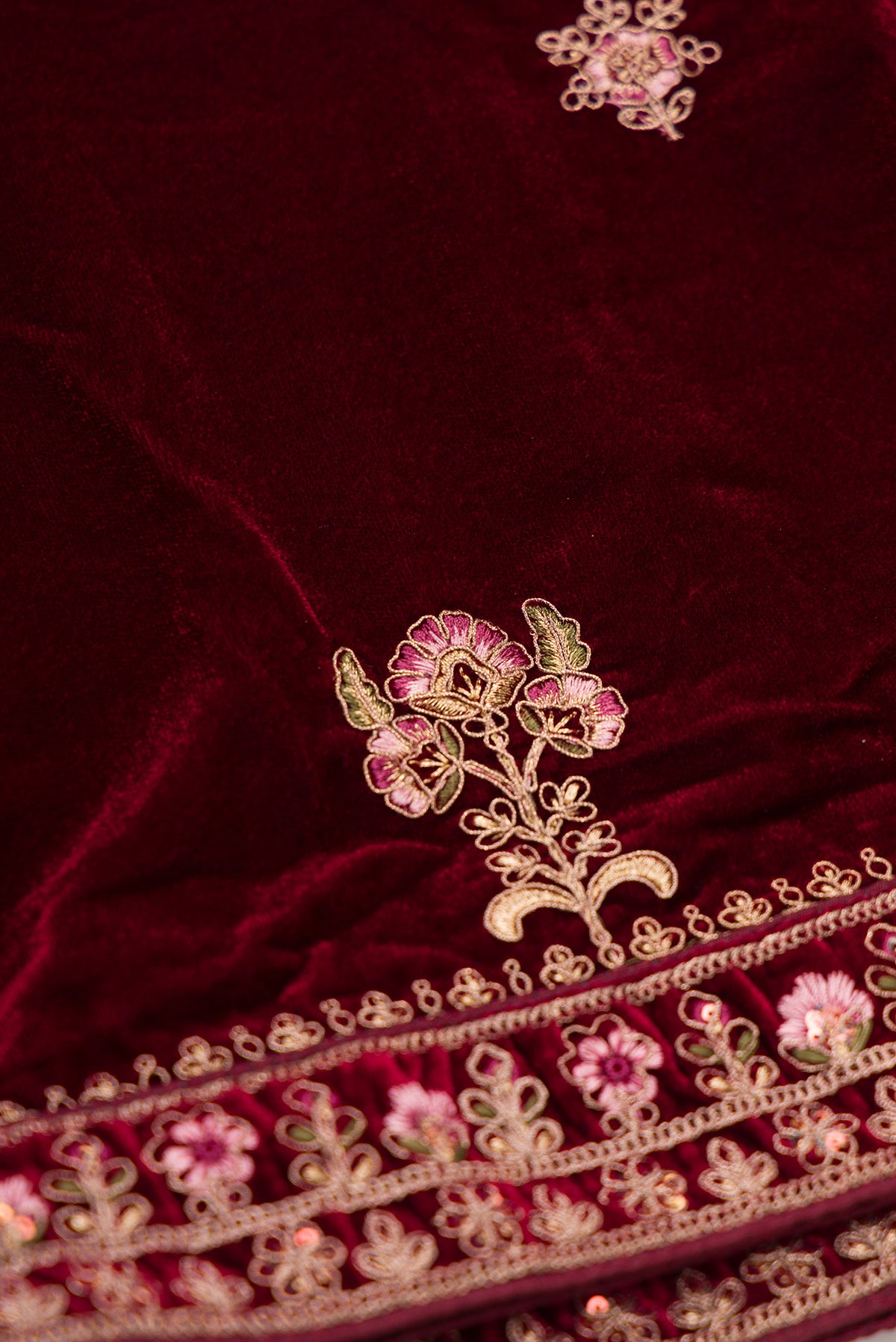 Close up blouse image of Maroon Banarasi Silk Womens Lehenga set featuring Embroidered Choli paired with Maroon Embroidered Skirt with Embroidered Border and a Embroidered dupatta in Maroon