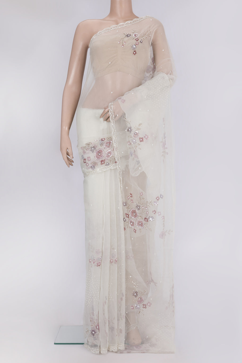 Off White Organza Saree with Embroidery on the body and Embroidery Border.  displayed on a mannequin