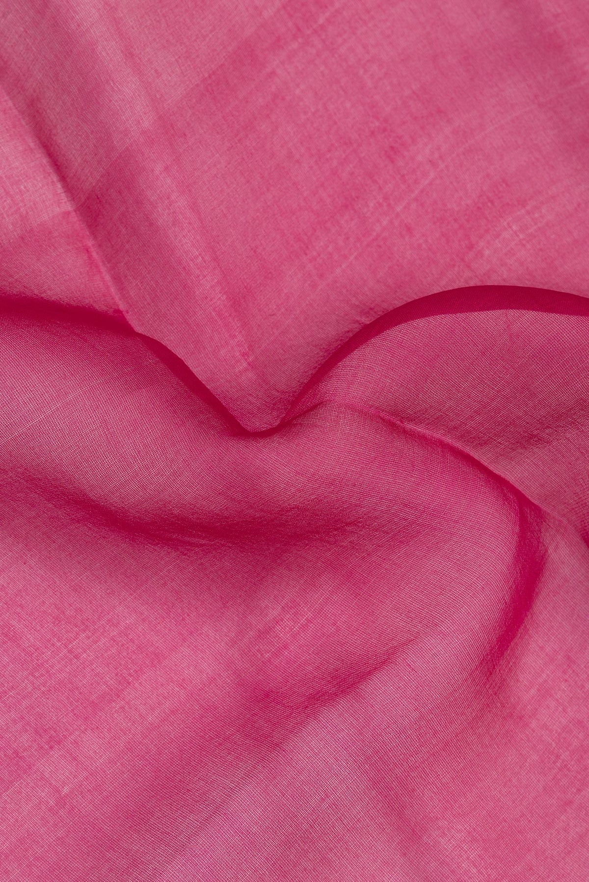 Close up of Pure Silk Dark Pink Dual Tone Tussar Saree with Plain Body and Fancy Border.  displaying folds