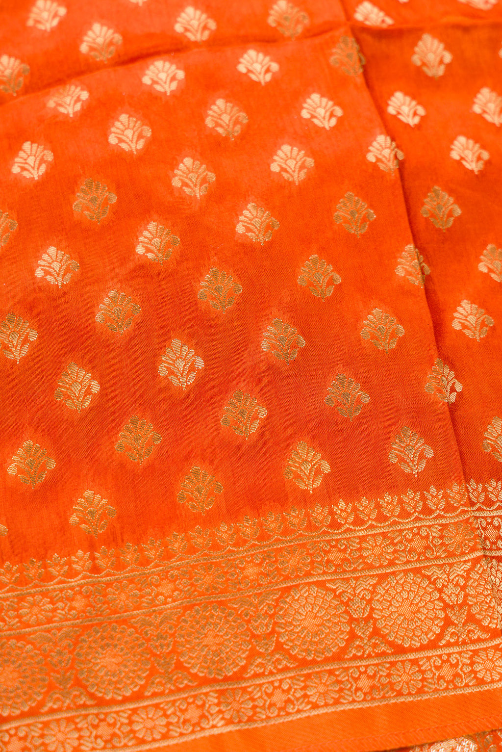 Detailed shot of Orange Banarasi Silk Womens Lehenga set featuring Embroidered Choli paired with Orange Zari Brocade Skirt with Zari Border and a Embroidered dupatta in Orange