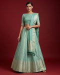 Light Green Banarasi Silk Womens Lehenga set featuring Zari Brocade Choli paired with Light Green Zari Brocade Skirt with Zari Border and a Zari Butta dupatta in Light Green