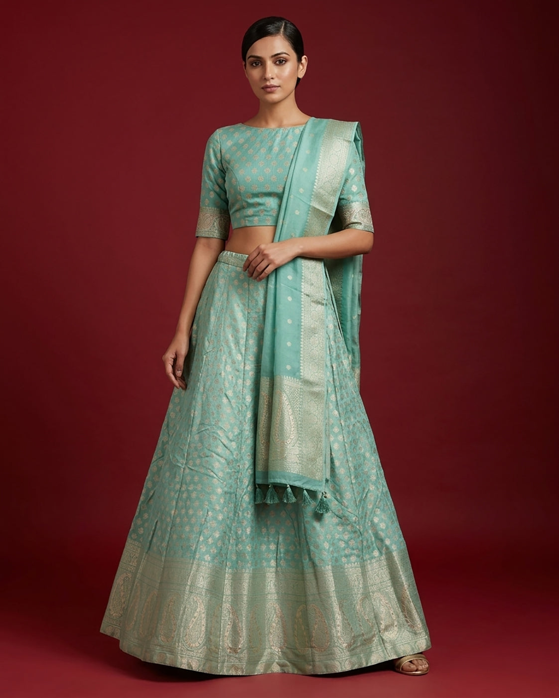 Light Green Banarasi Silk Womens Lehenga set featuring Zari Brocade Choli paired with Light Green Zari Brocade Skirt with Zari Border and a Zari Butta dupatta in Light Green
